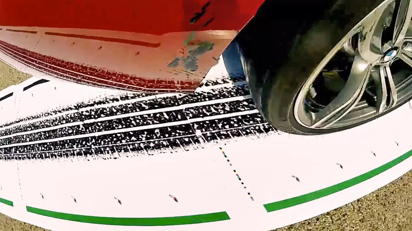 A closeup of a printed tire track created by putting ink on tires