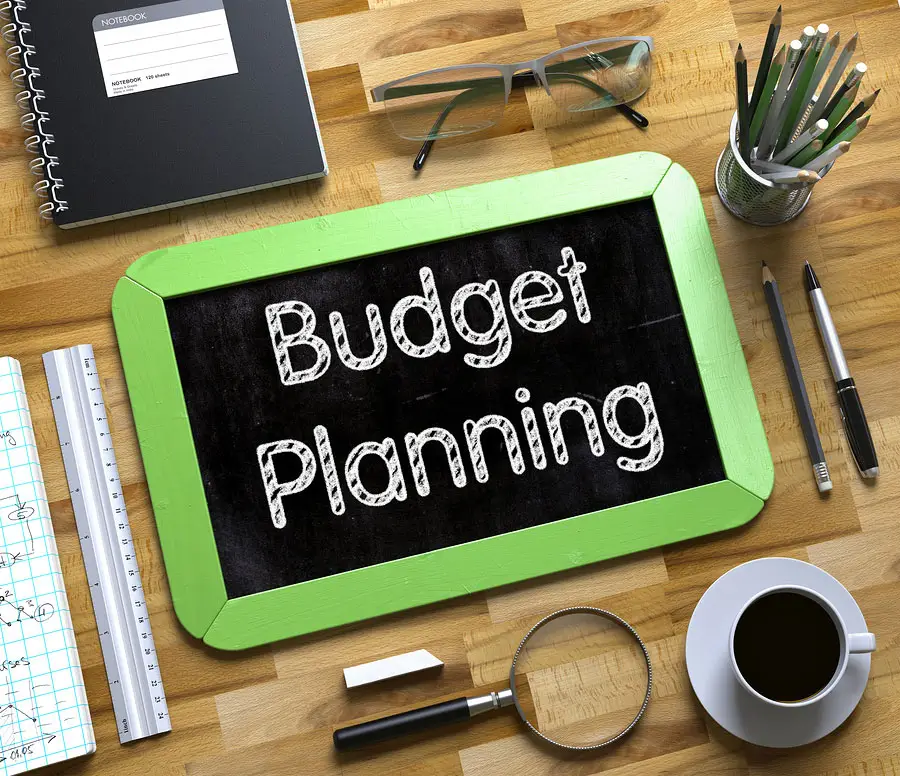 The words 'budget planning' on a chalkboard