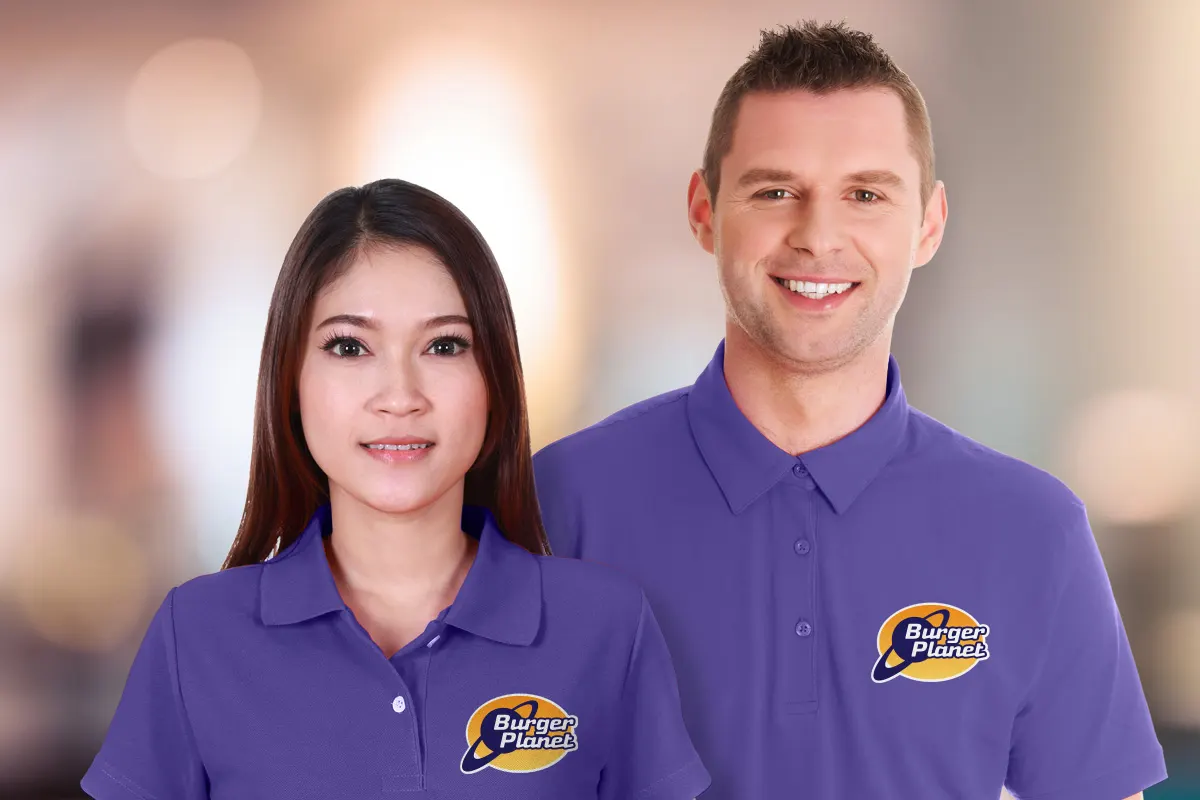 Two fast food employees wearing custom logo apparel