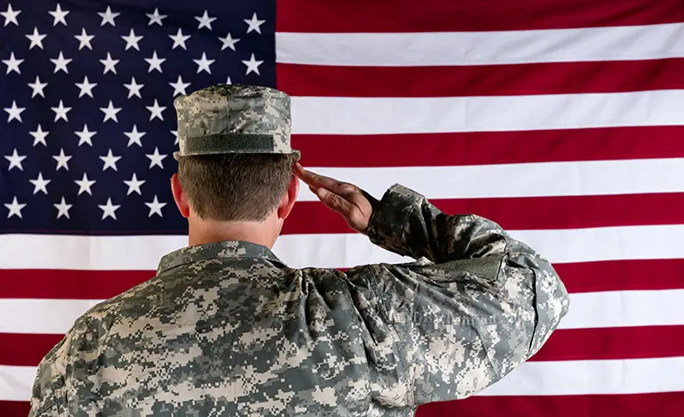 Soldier saluting the flag