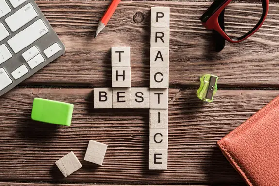 Letter tiles spelling out the words "the best practice"