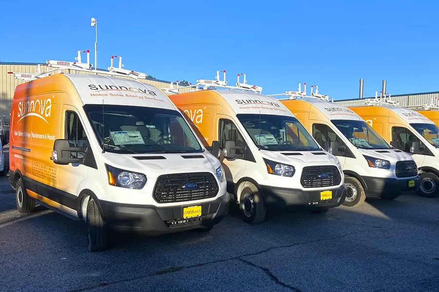 A fleet of vans with custom graphics